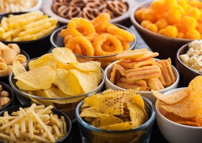 Photo Of Various Salty Snacks In Bowls On A Table